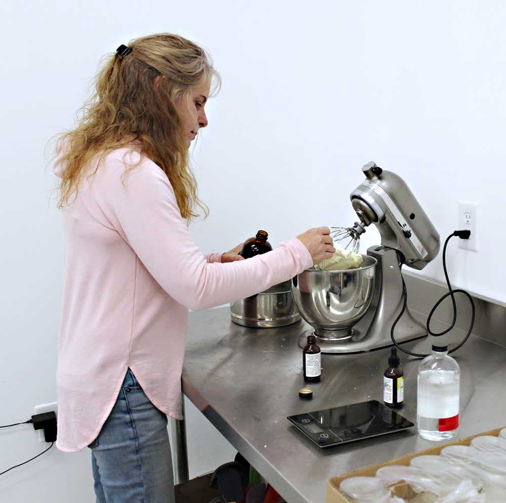 Wendy carefully making all natural skincare products